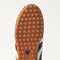 Close up of the durable rubber outsoles of The Ivy Sneaker in ReVelvet Cheetah.