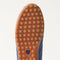 Close up of the durable rubber outsoles of The Ivy Sneaker in ReVelvet Overcast.