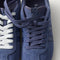 Overlay:: Extra pair of laces included—swap for a new look anytime. | Alt:: Close up of the top of The Ivy Sneaker in ReVelvet Overcast, showing different lace choices.