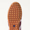 Close up of the durable rubber outsoles of The Ivy Sneaker in ReVelvet Syrah.