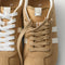 Overlay:: Extra pair of laces included—swap for a new look anytime. | Alt:: Close up of the top of The Ivy Sneaker in ReVelvet Wren, showing different lace choices.