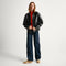 Alternate view of a model wearing The Ivy Sneaker in ReVelvet Wren. 