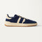 side | The Men's Court Sneaker in ReVelvet™ Deep Navy shown from the side.