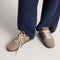 hover | Model wearing The Men's Court Sneaker in ReVelvet™ Sparrow.