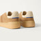 Close up of the heel of The Men's Court Sneaker in ReVelvet™ Pecan, with Rothy's signature blue halo.
