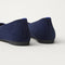 Close up of the heel of The Max Square Ballerina in ReVelvet Navy with Rothy's signature blue halo.