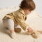 hover | Alternative image of child wearing The Baby Moc in Frosted Teddy.
