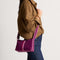 hover | Model wearing The Casual Crossbody in ReVelvet Orchid, shown from the front.