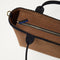 A close up of The Lightweight Zip Tote in ReVelvet Cinnamon focusing on the zip closure and handles.