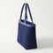 The Lightweight Zip Tote in ReVelvet Deep Navy shown from the side.