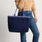 hover | Model holding The Lightweight Zip Tote in ReVelvet Deep Navy.