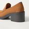 Close up of the heel of The Block Heel Loafer in ReVelvet Caramel, with Rothy's signature blue halo. 