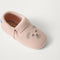 Close up of the top of  The Baby Moc in Blush Teddy.