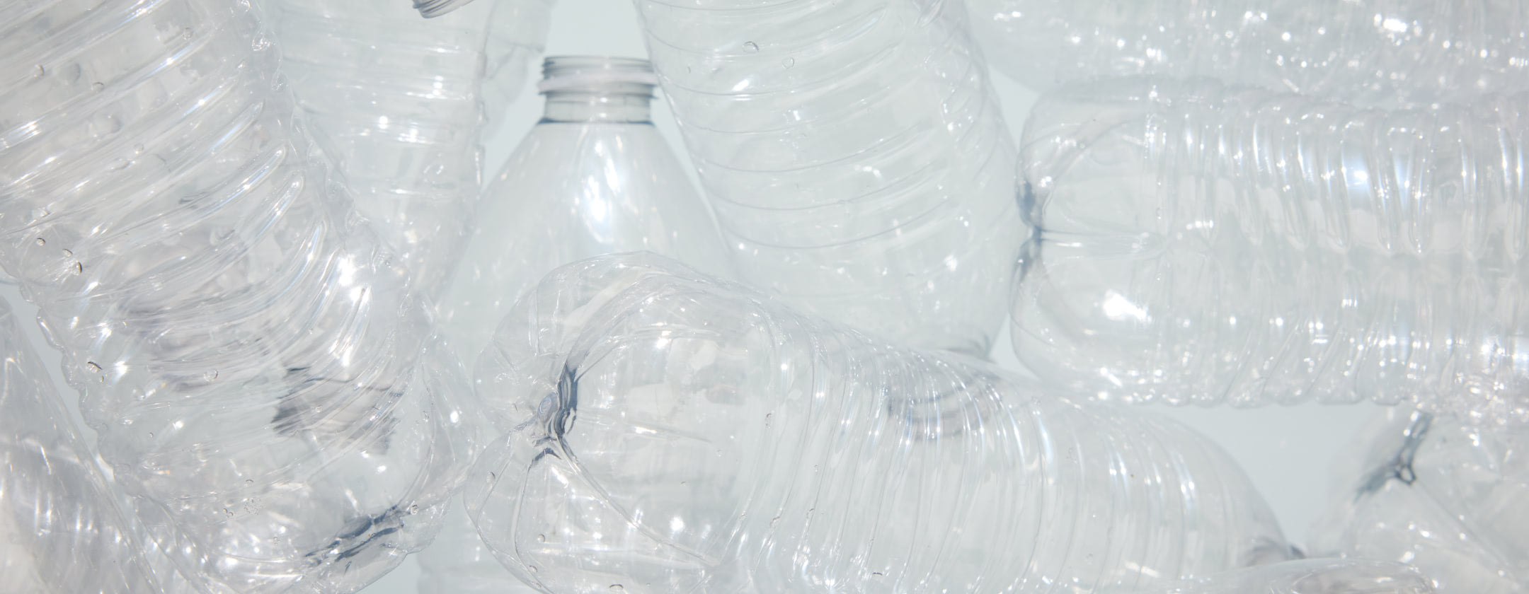 Image depicting close up of recyled plastic water bottles.
