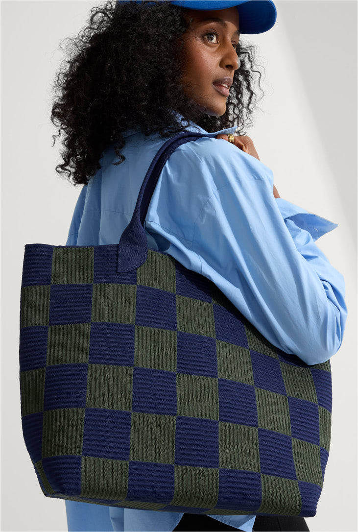 a female model wearing the Lightweight Tote in Checker Blue