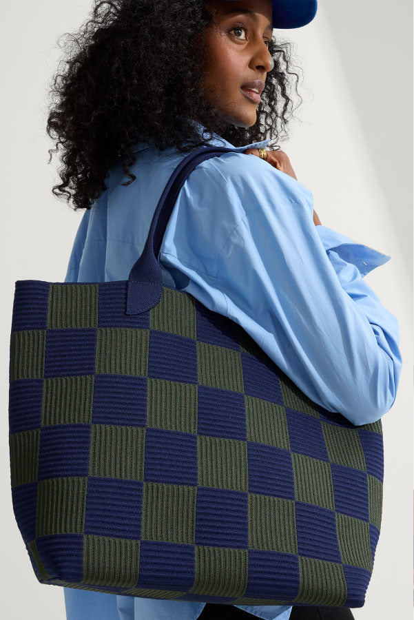 a female model wearing the Lightweight Tote in Checker Blue