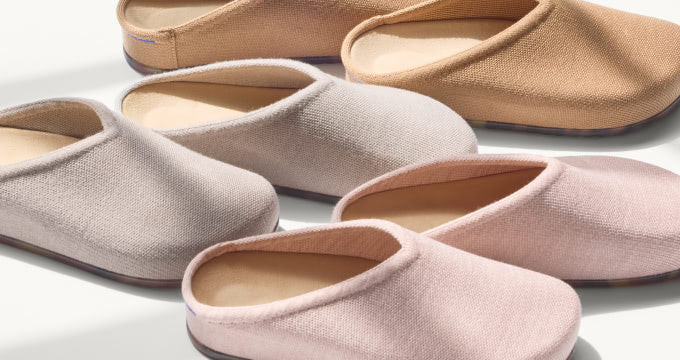 Three pairs of The Casual Clog in tan, light grey and pink.