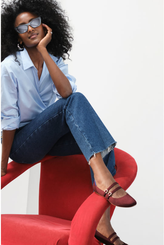 A model wearing The Double Buckle Mary Jane in Cabernet.