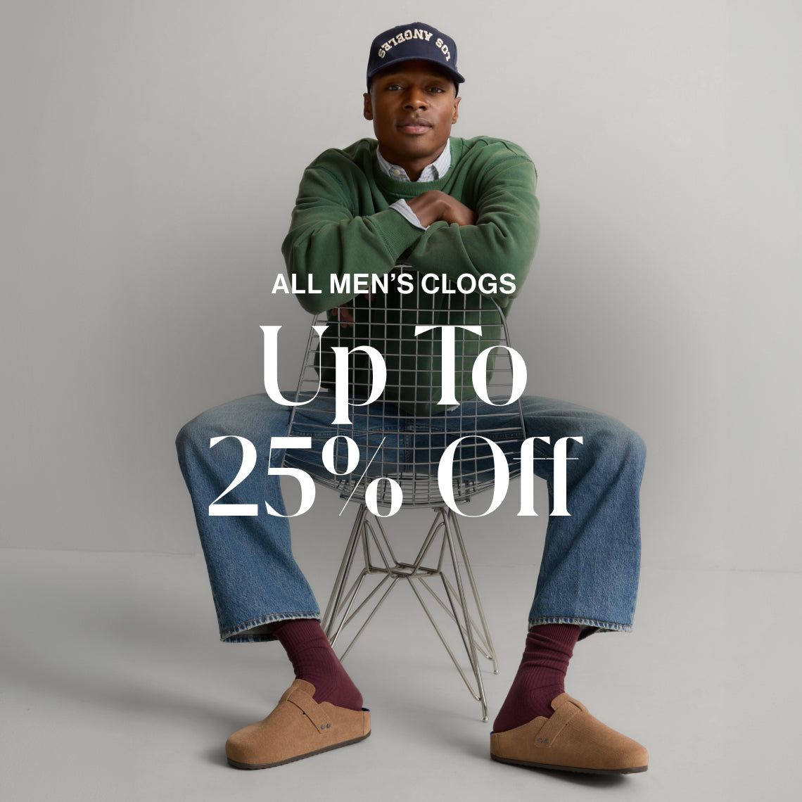 A model wearing The Men's Clog with copy overlay reading ALL MEN'S CLOGS | Up To 25% Off