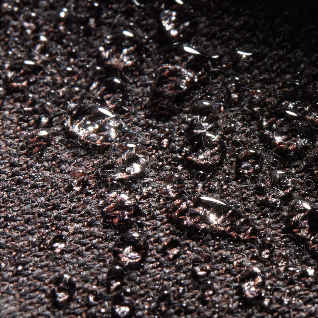 A swatch of dark brown water repellant merino & rPET.