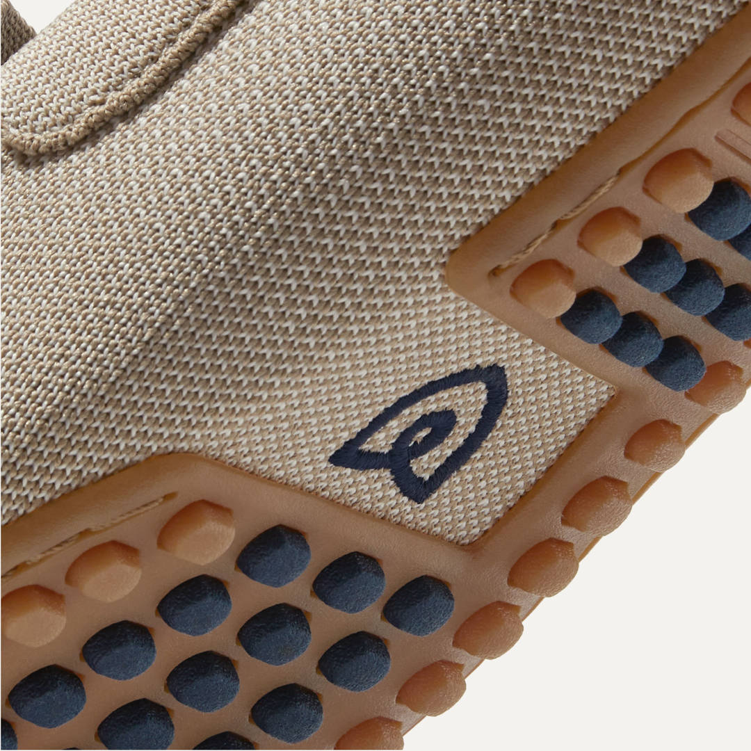 A close up view of the outsole of The Driving Loafer, with raised nubs for extra grip.