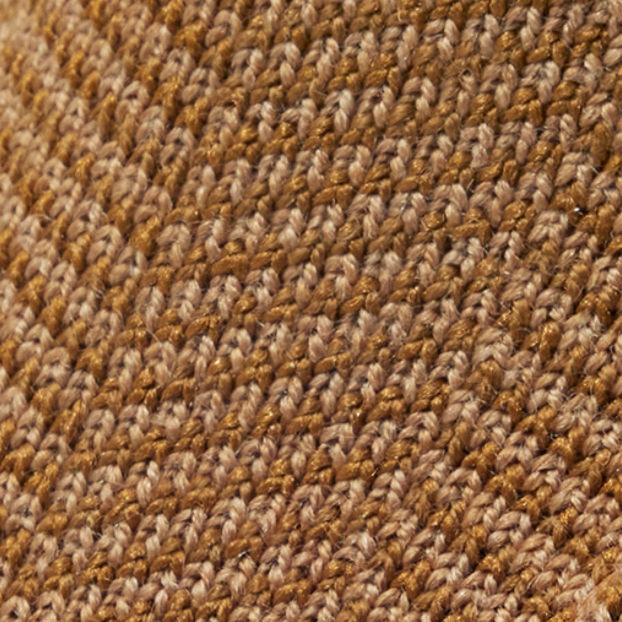 A swatch of  our knit blend of merino wool & rPET in a brown herringbone pattern.