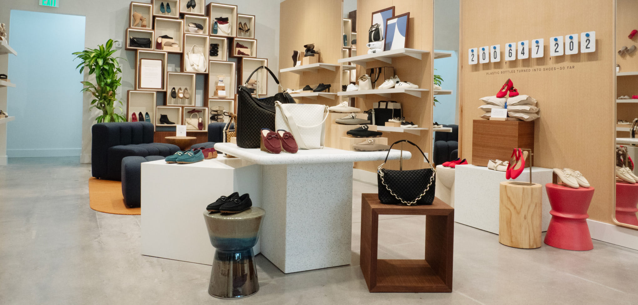 Interior of a Rothy's CItyPlace store with various handbags and shoes displayed on shelves and tables.