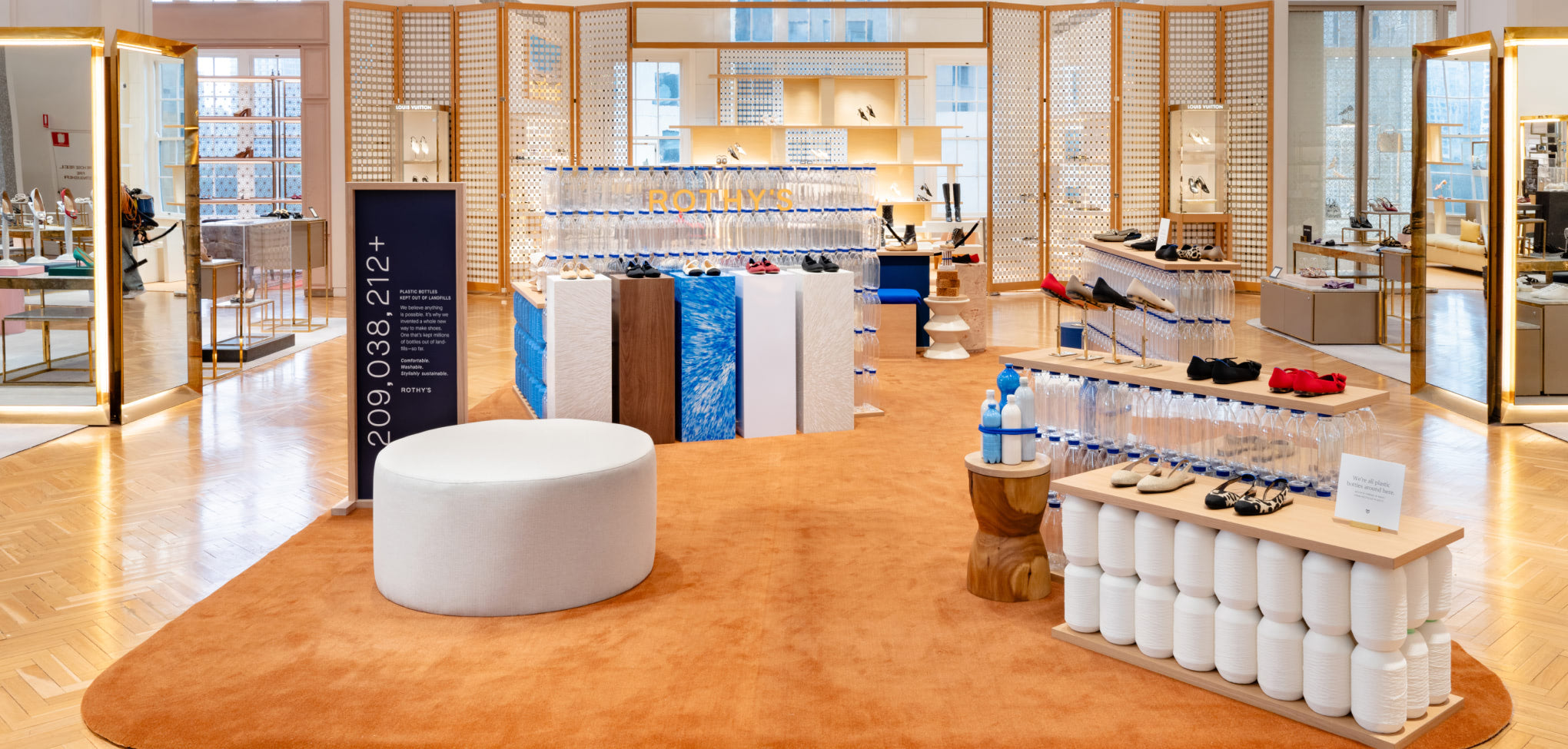 Rothy's store interior design with white furniture and orange carpet, in David Jones Australia.
