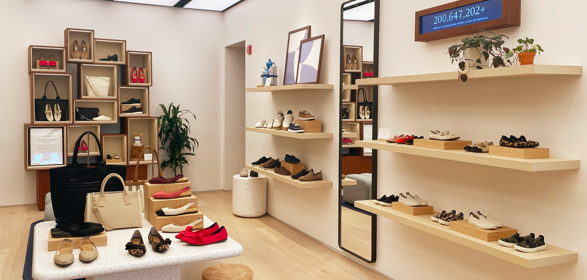 Rothy's interior store with wooden furniture and neutral tones