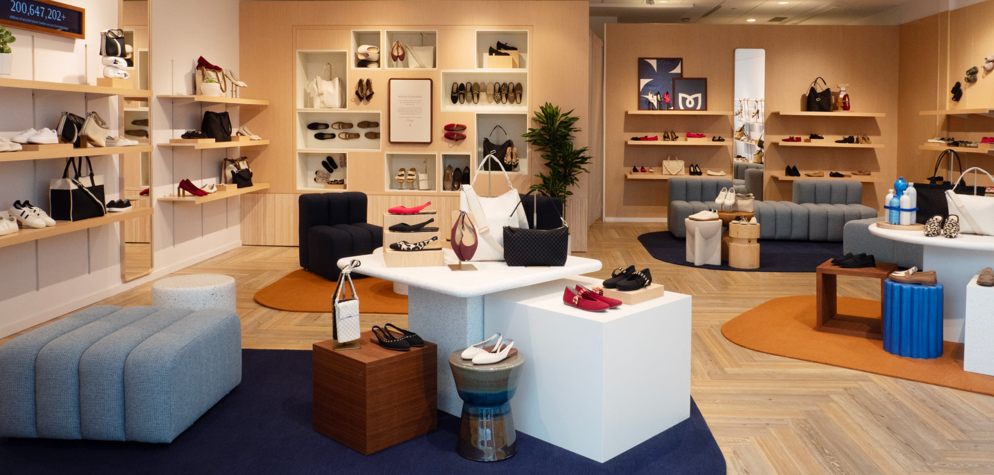 Rothy's display area with various bags and shoes on shelves in a store.