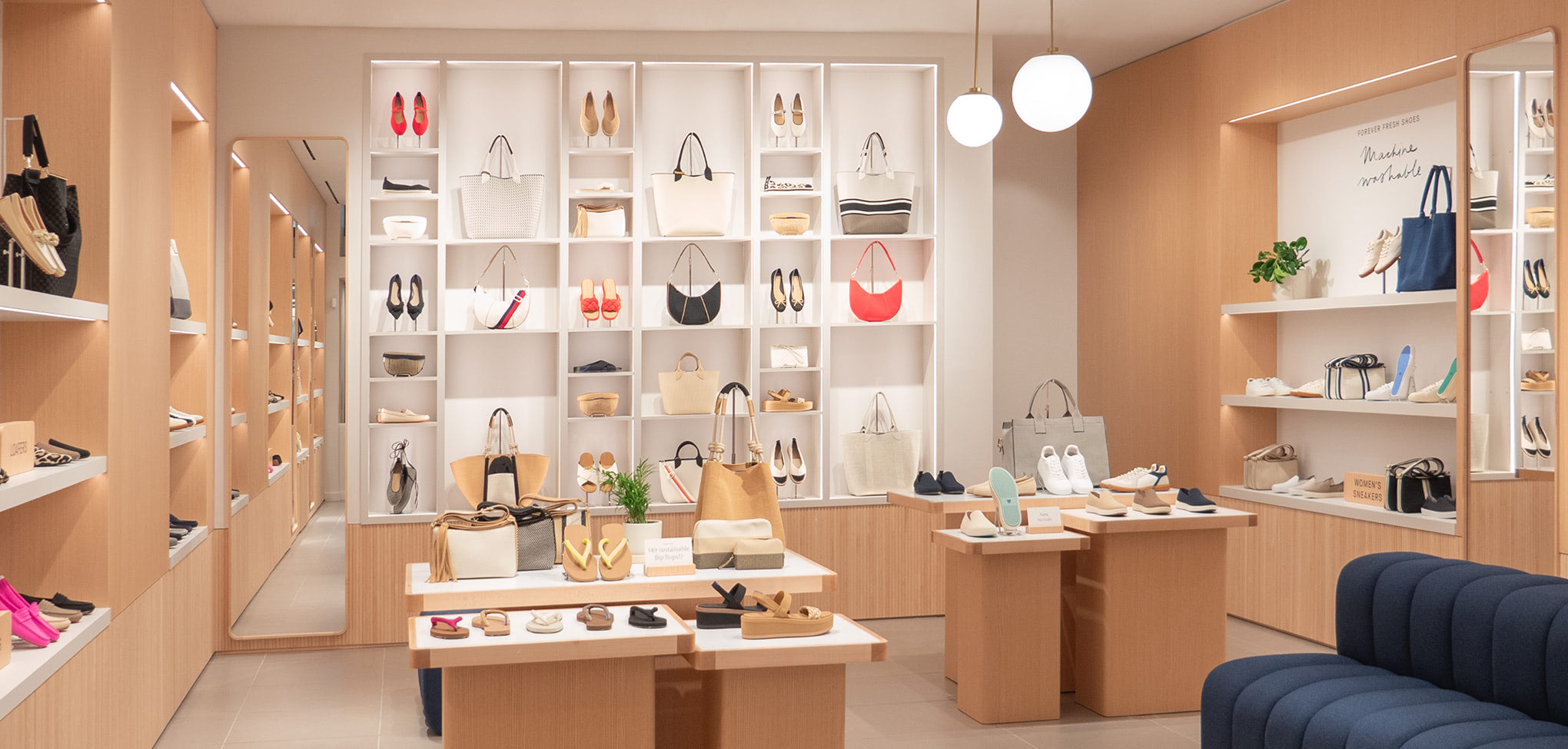 Rothy's interior store with shelves displaying handbags and accessories.