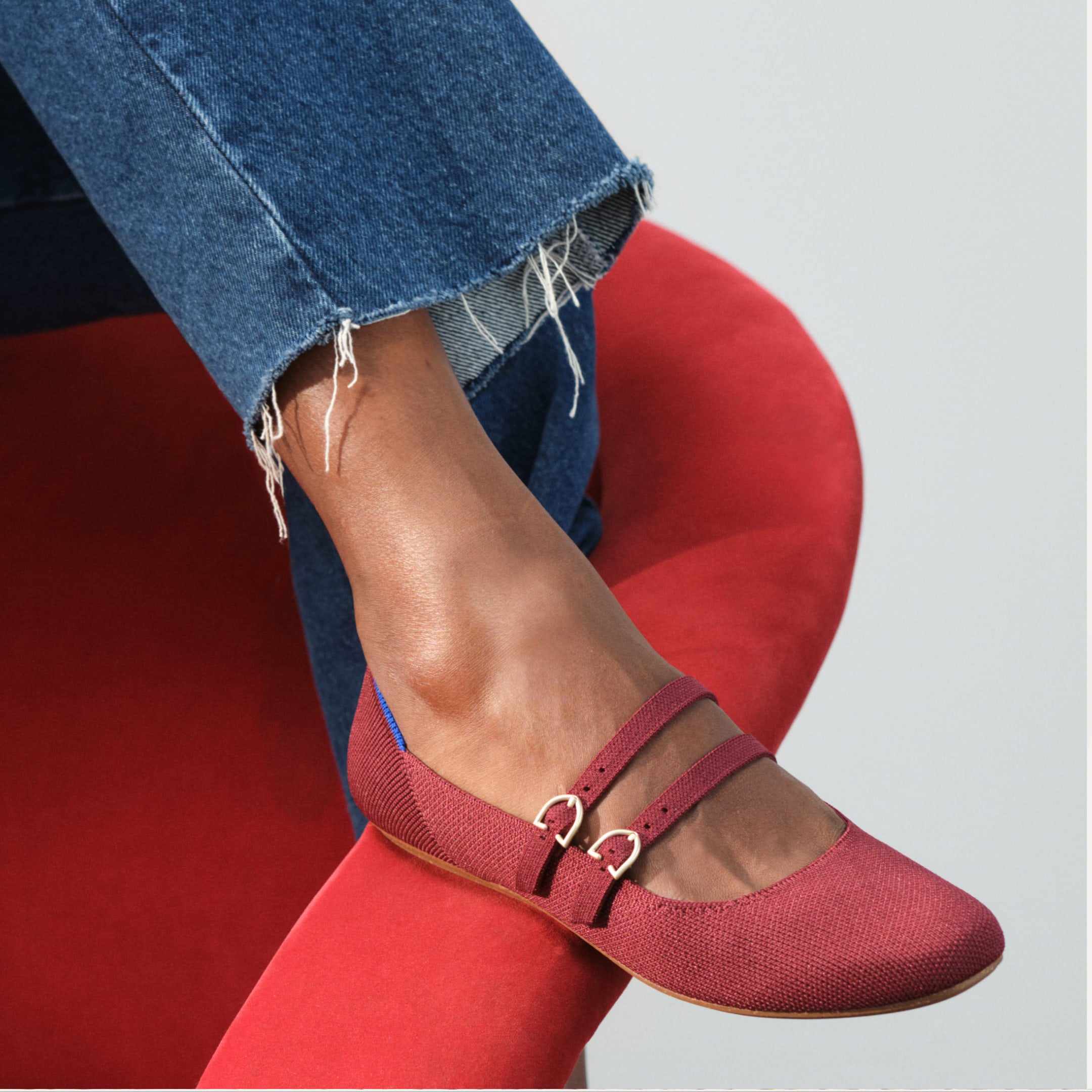 The Double Buckle Mary Jane shown on model's foot.