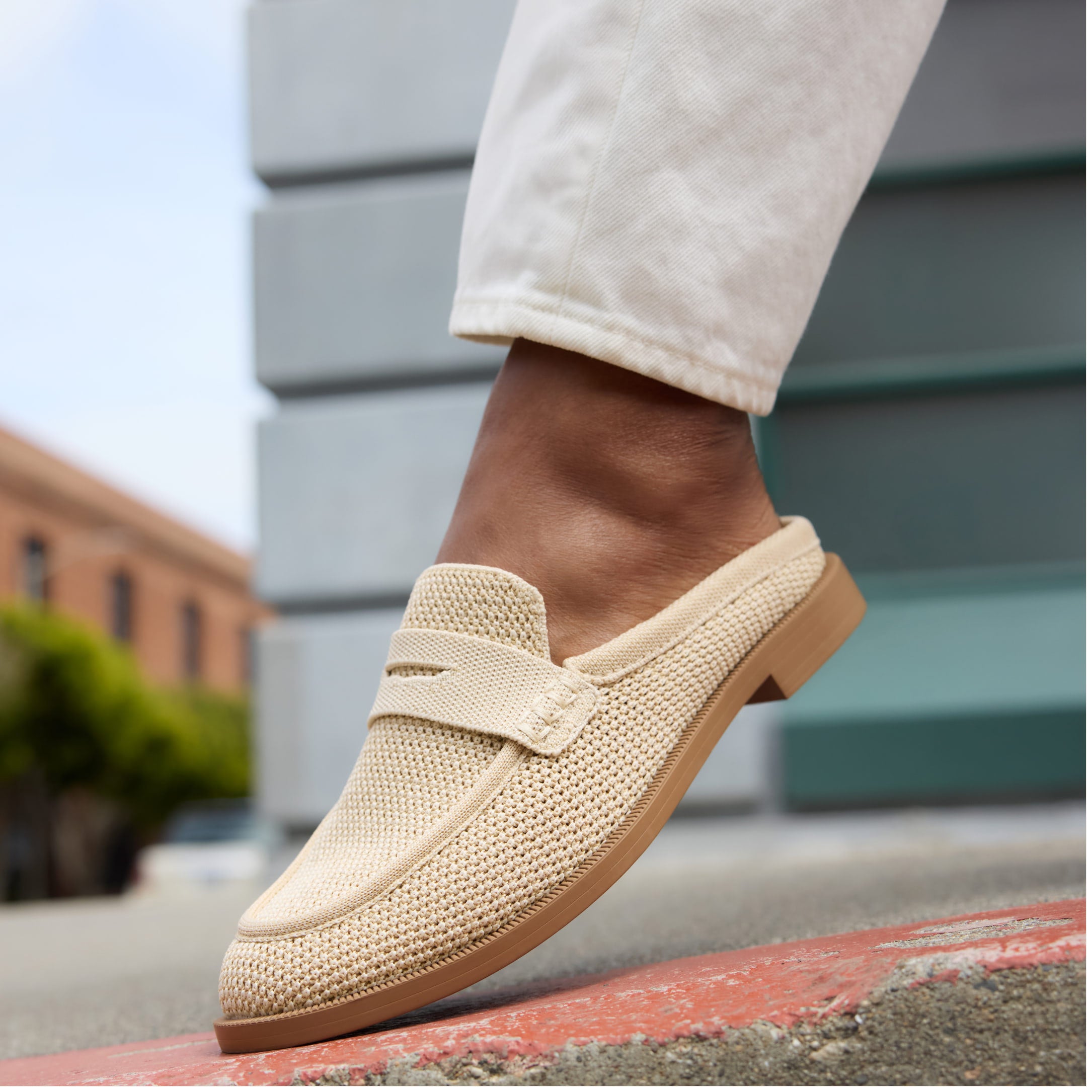 The Penny Loafer Mule shown on a model's foot.