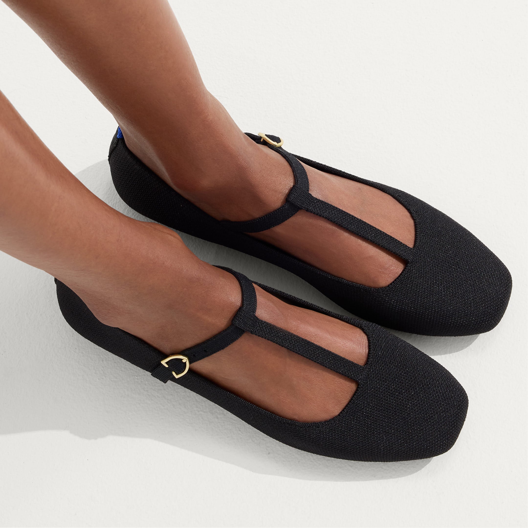 Close up of a model wearing The T-Strap Mary Jane.