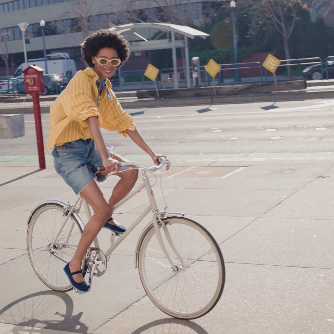 Models wearing The Cruiser Loafer and Mary Jane and showing different angles of the shoes.