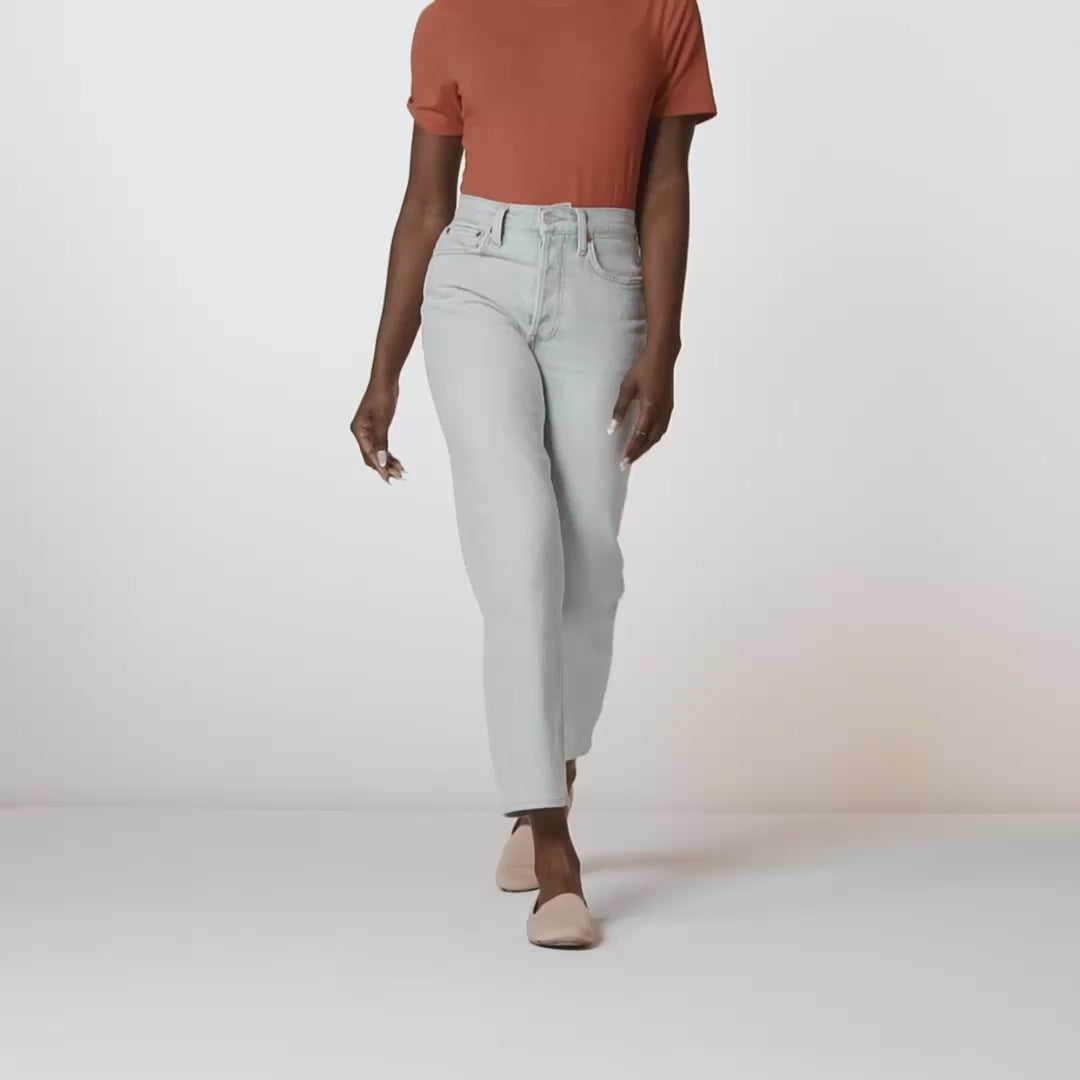 Model walking in The Loafer in Ecru and showing different angles of the shoes. 