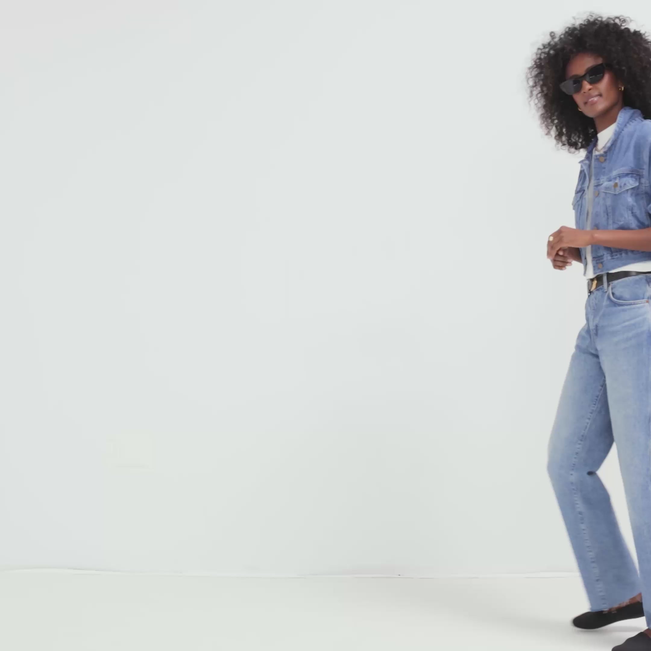 Model walking in The Loafer in Black Solid and showing different angles of the shoes. 