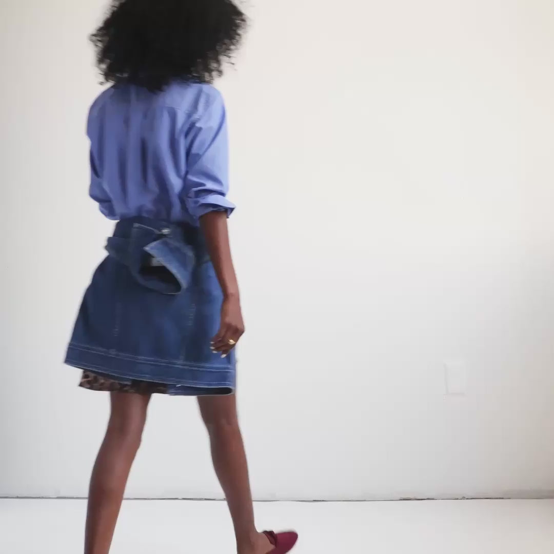 Model moving around in The Loafer Mule in Auburn, showing different angles of the shoe. 