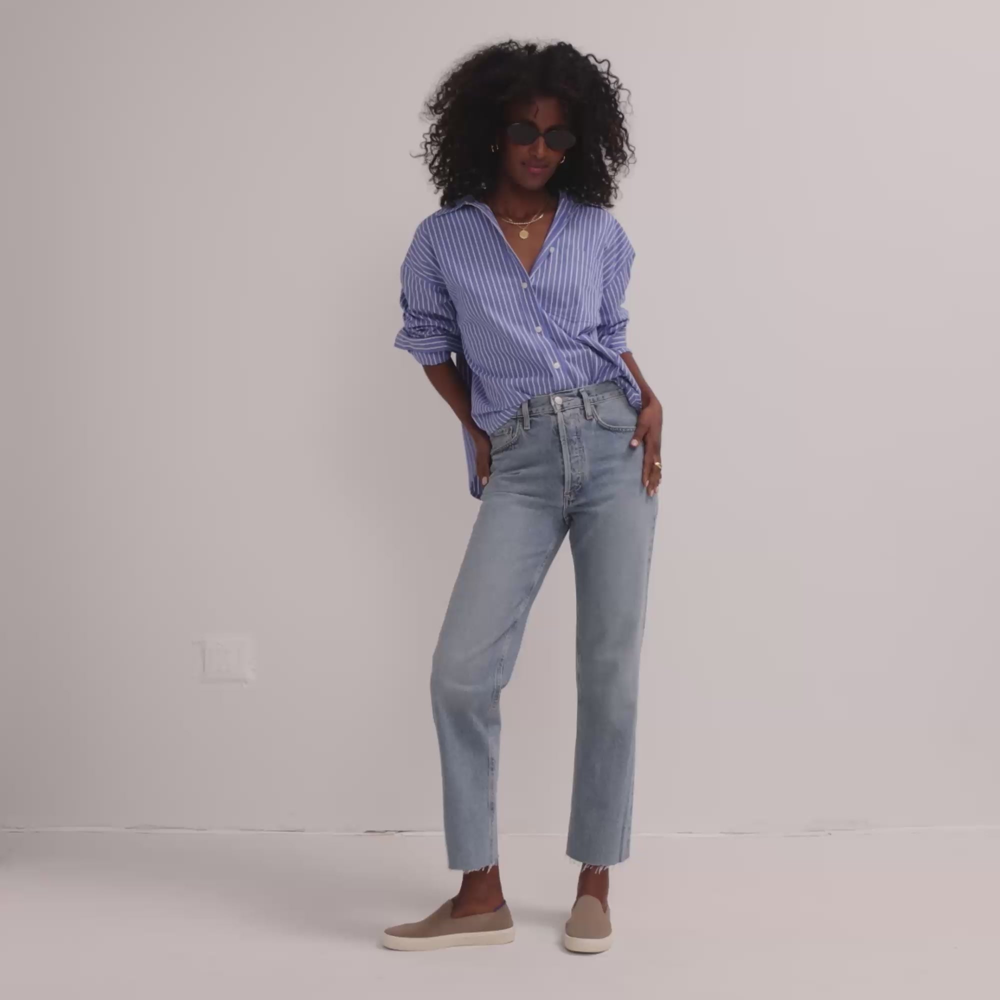 Model walking in The Original Slip On Sneaker in Latte and showing different angles of the shoes. 