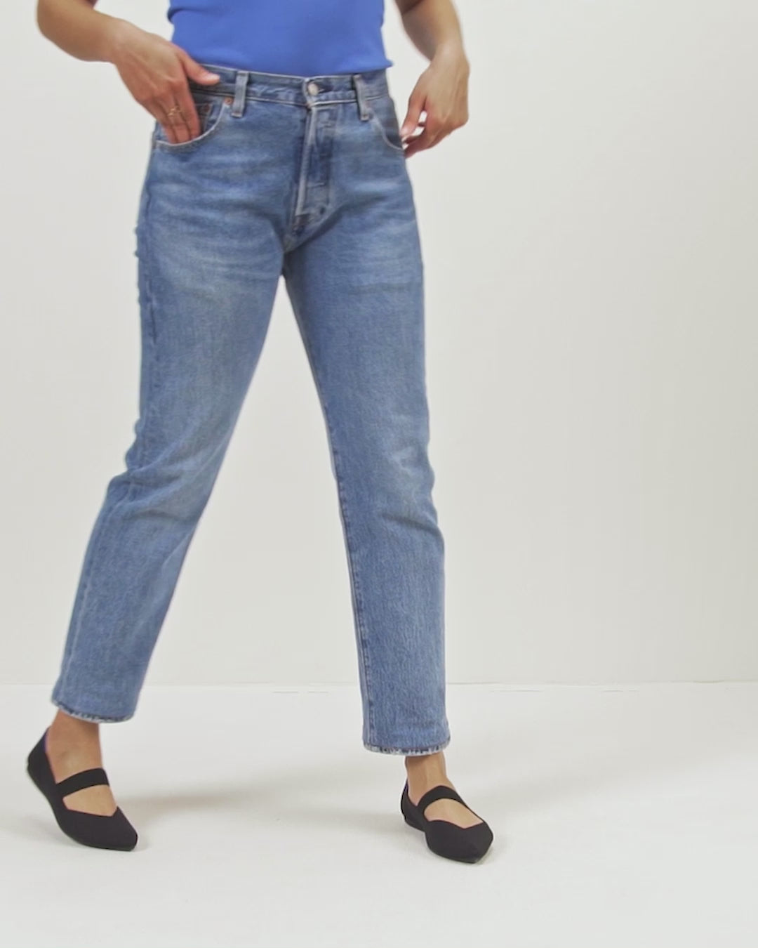 Model walking in The Point Mary Jane in Black and showing different angles of the shoes. 