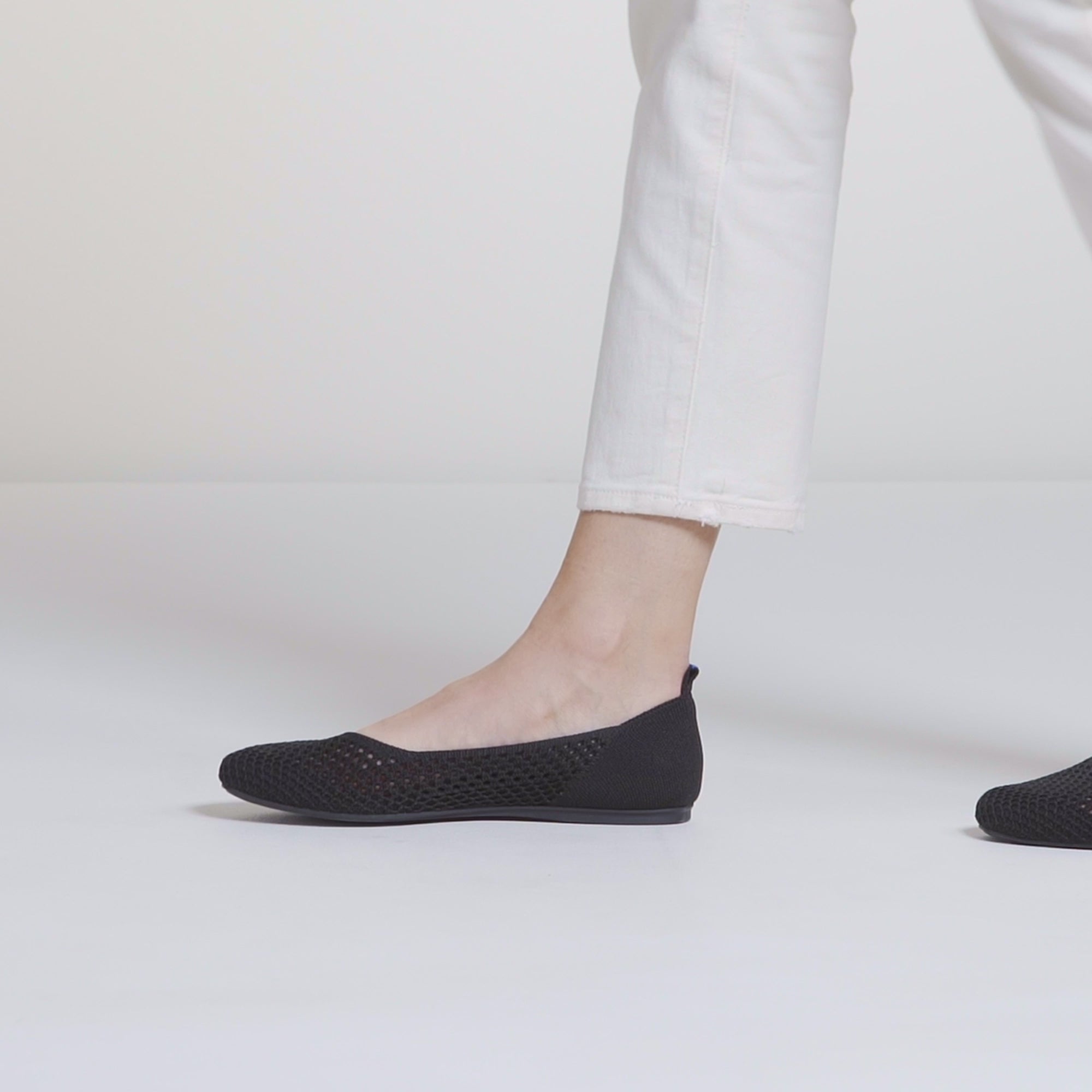 Model walking in The Square Wrap in Noir Mesh and showing different angles of the shoes. 