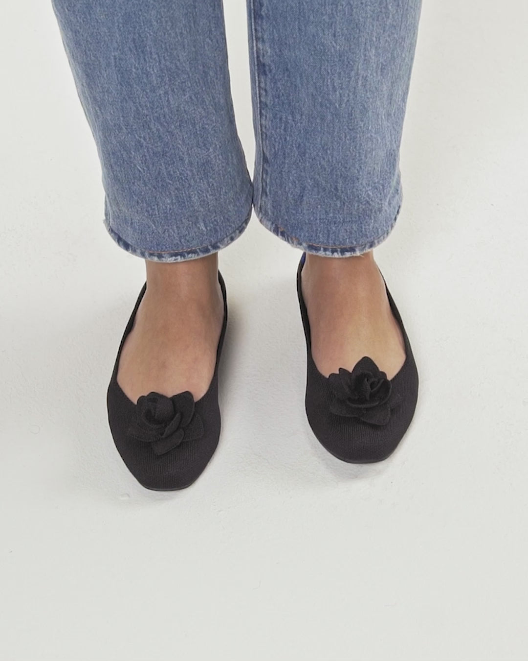 Model walking in The Petal Square in Black and showing different angles of the shoes.