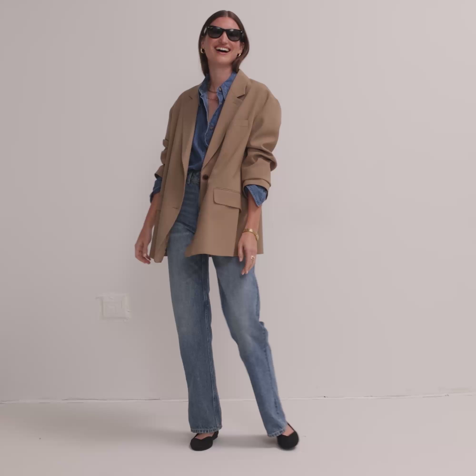 Model walking in The Flat in Black Solid and showing different angles of the shoes.