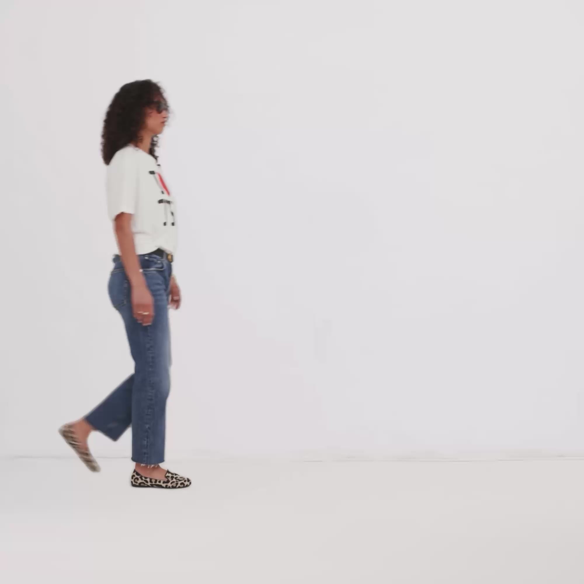 Model walking in The Daily Loafer while showing different angles of the shoes. 