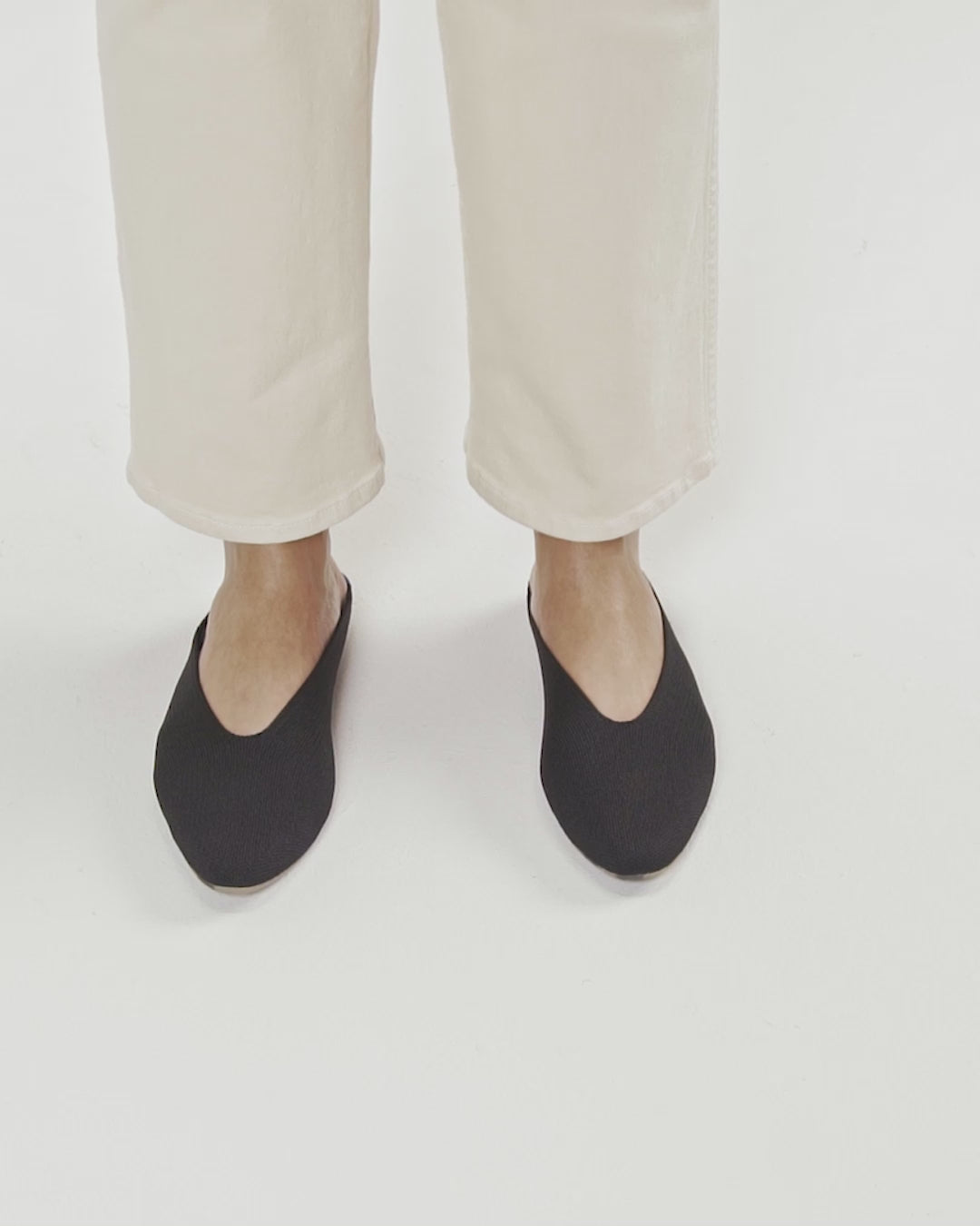 Model walking in The Almond Demi in Black and showing different angles of the shoes.