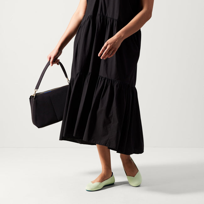 Alternate view of a model wearing The Flat in Sour Apple. 
