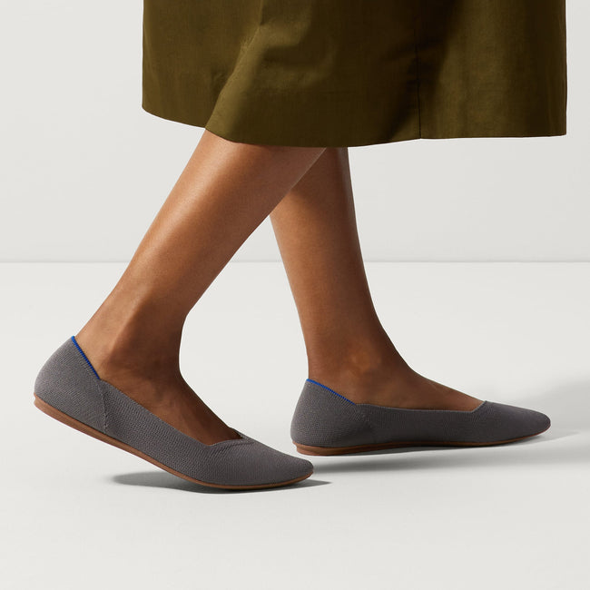 hover | Model wearing The Point in Pebble Grey. 