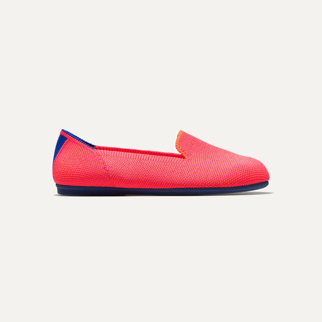 The Kids slip-on Loafer in Flamingo shown from a side view showing the outsole.