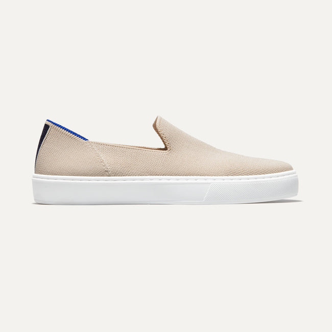 The slip-on Sneaker in Sand shown from a side view showing the outsole.