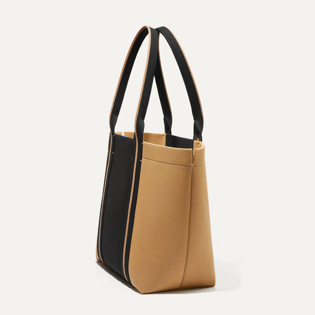 The Essential Tote in Camel and Black shown in diagonal view.